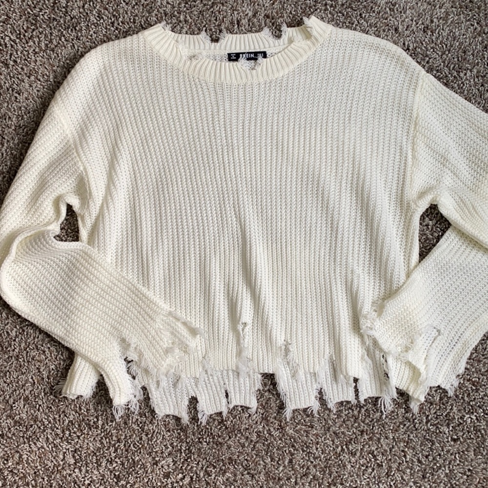 Distressed white sweater